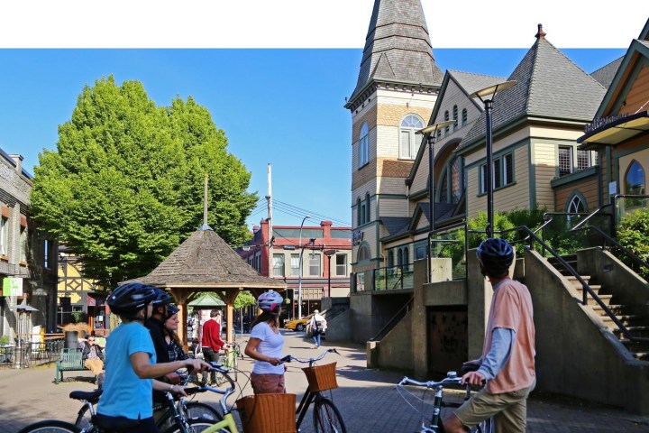 a group of people walking in front of a building
