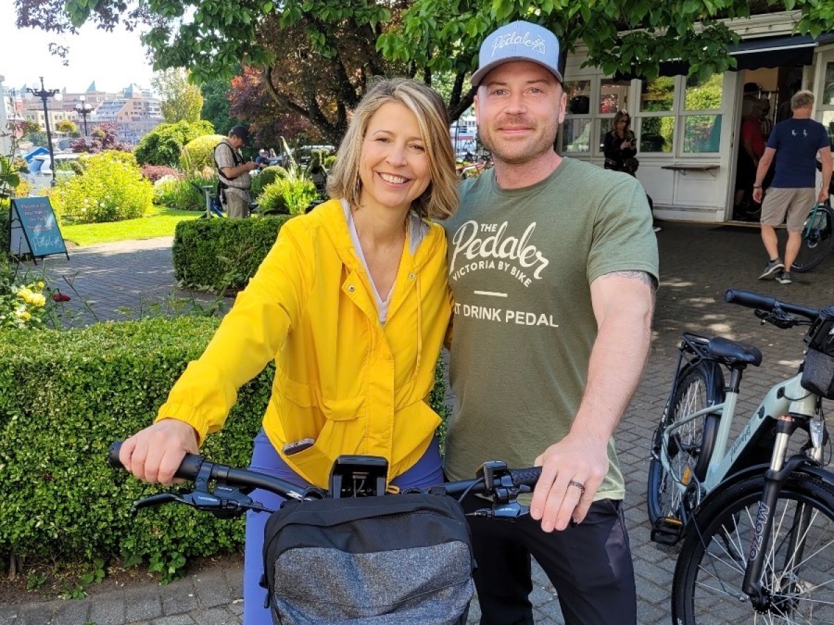 Samantha Brown and woman riding on the back of a bicycle