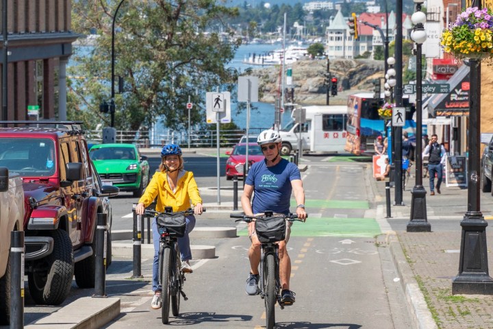 a person riding a bicycle on a city street